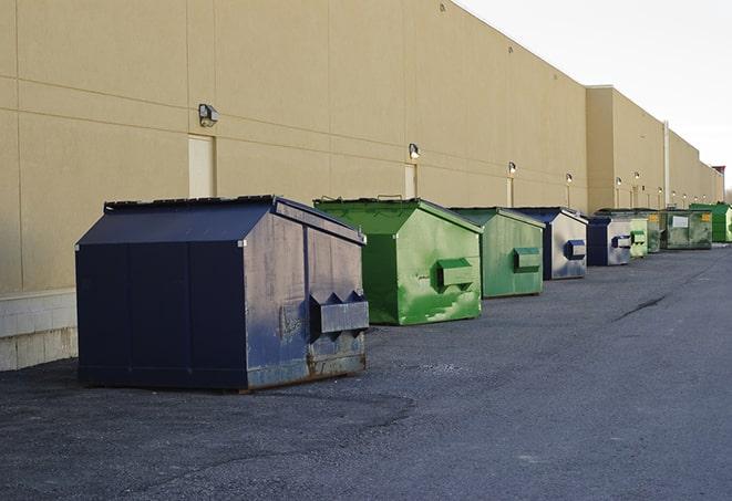 multiple construction dumpsters for waste management in District Heights